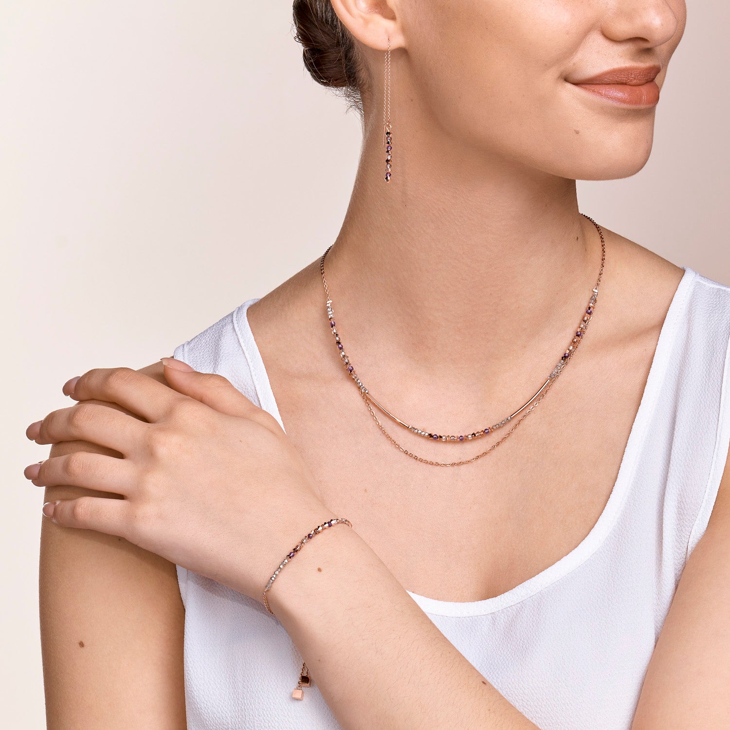 Bracelet 2-layers de cristaux fins et d'acier inoxydable or rose lilas
